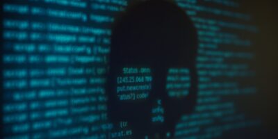 a computer screen with text and a skull, crypto scam