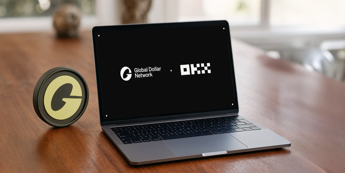 a laptop on a table, OKX, USDG, Paxos, Stablecoin