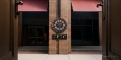 a sign on a brick building. Offshore Crypto Exchanges are Now Welcome for U.S. Traders per CFTC Advisory
