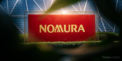 a red sign with gold text Nomura. Dubai Makes History: Laser Digital Wins First OTC Crypto Options License