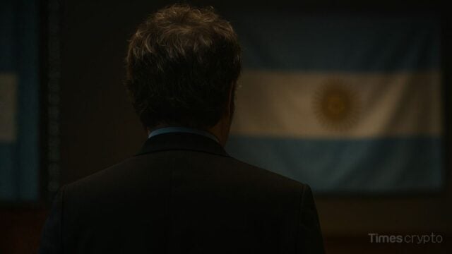 Javier Milei facing Argentine flag backdrop. LIBRA Scandal: Argentine Court Weighs Arrests for Milei's Advisors