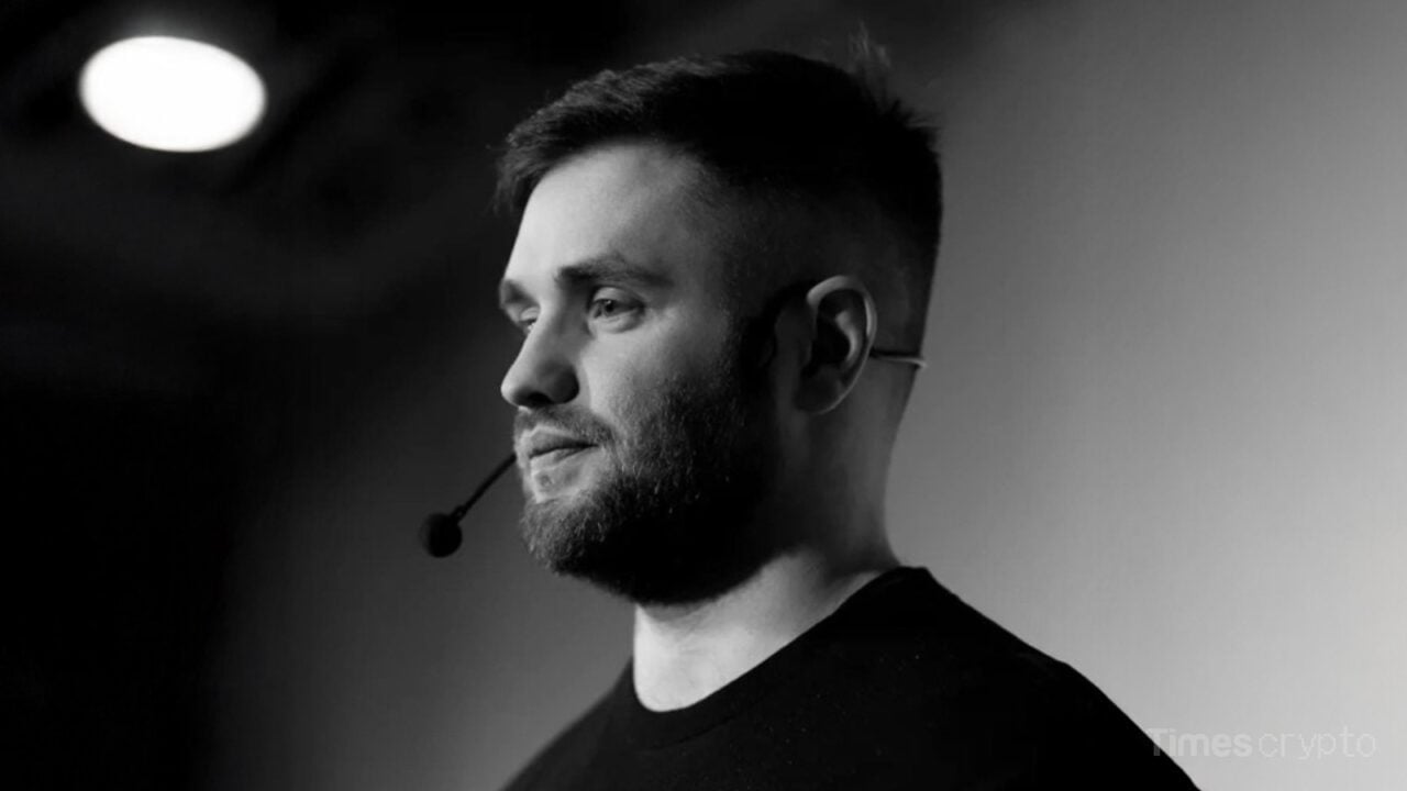 Kostya Kudo speaking with microphone on stage. Crypto Trader Found Dead in Lamborghini Amid Historic Market Crash